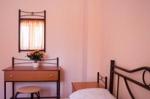 Postel nebo postele na pokoji v ubytování Manesi Apartments