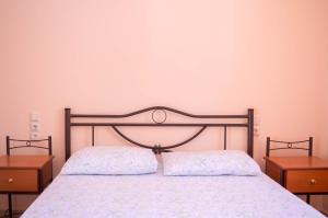 Postel nebo postele na pokoji v ubytování Manesi Apartments