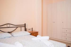 Postel nebo postele na pokoji v ubytování Manesi Apartments