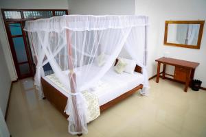 Letto o letti in una camera di BV Residence