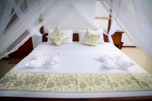 Letto o letti in una camera di BV Residence
