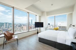 Postel nebo postele na pokoji v ubytování amba Taipei Songshan