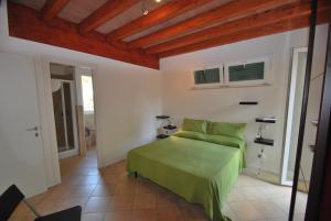 Postel nebo postele na pokoji v ubytování Villetta Ciclamino