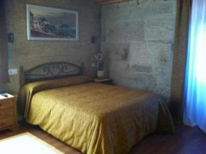 Cama o camas de una habitación en As Chivas