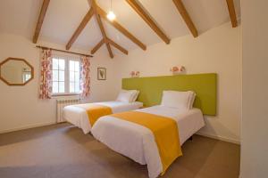 A bed or beds in a room at Quinta Santo Antonio Da Serra