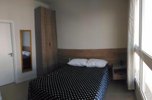 Ein Bett oder Betten in einem Zimmer der Unterkunft Estudio em Palmas do Arvoredo - Gov. Celso Ramos