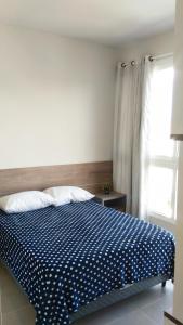 Ein Bett oder Betten in einem Zimmer der Unterkunft Estudio em Palmas do Arvoredo - Gov. Celso Ramos