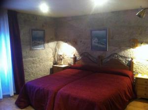 Cama o camas de una habitación en As Chivas