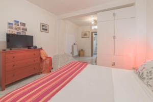 A bed or beds in a room at Apartment Pink21