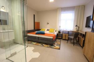 Posteľ alebo postele v izbe v ubytovaní Apartamenty Garbary 3