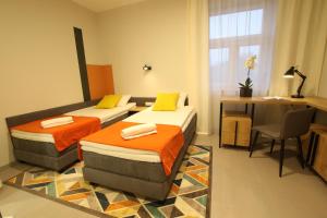 Posteľ alebo postele v izbe v ubytovaní Apartamenty Garbary 3