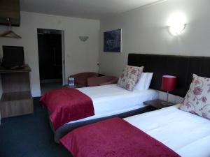 Postel nebo postele na pokoji v ubytování The Park Hotel Ruapehu