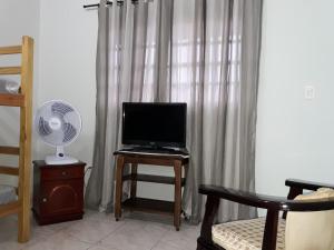 Et tv og/eller underholdning på Casa com Quintal Amplo