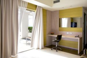 Ένα ή περισσότερα κρεβάτια σε δωμάτιο στο Jazz Hotel