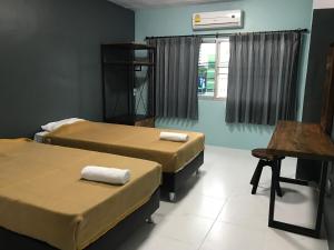 Postel nebo postele na pokoji v ubytování Nimman Expat Home