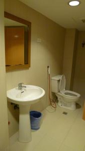 a bathroom with a sink and a toilet at Cebuview Tourist Inn in Cebu City