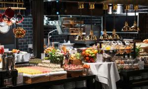 a table topped with lots of different types of food at Thon Hotel Nordlys in Bodø