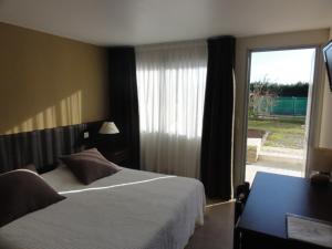 Krevet ili kreveti u jedinici u okviru objekta Hotel La Longue Vue