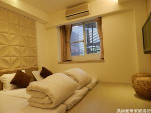 Postel nebo postele na pokoji v ubytování 谷關明高溫泉 Mingao Hot Spring Resort