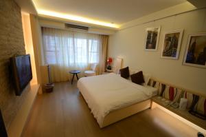 Katil atau katil-katil dalam bilik di 谷關明高溫泉 Mingao Hot Spring Resort