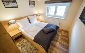 Posteľ alebo postele v izbe v ubytovaní Apartamenty Sun & Snow Szklarska Perła