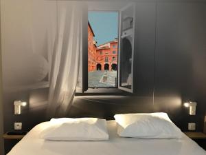 Postel nebo postele na pokoji v ubytování B&B HOTEL Montauban