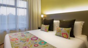 Katil atau katil-katil dalam bilik di Tamarind Tree Hotel