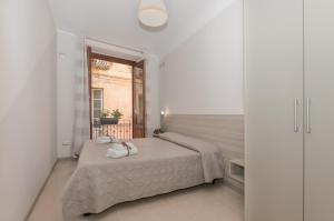 Posteľ alebo postele v izbe v ubytovaní Casa Vico Romano 2