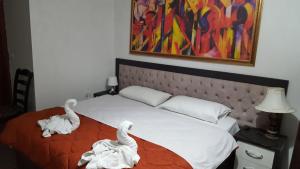 Postel nebo postele na pokoji v ubytování Hotel Livia