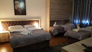 Postel nebo postele na pokoji v ubytování Hotel Livia