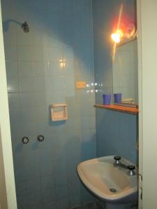 Um banheiro em Hotel Perla Central