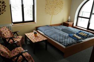 מיטה או מיטות בחדר ב-Apartmány Šedek