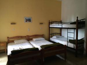 A bed or beds in a room at Avgoustina Venus Studios