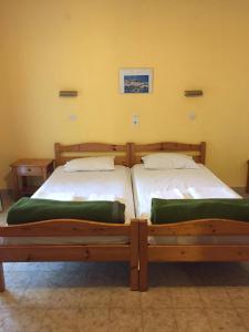 A bed or beds in a room at Avgoustina Venus Studios