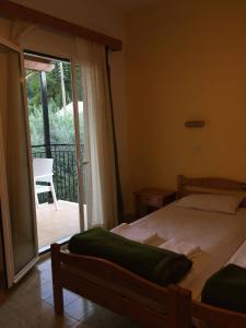 A bed or beds in a room at Avgoustina Venus Studios
