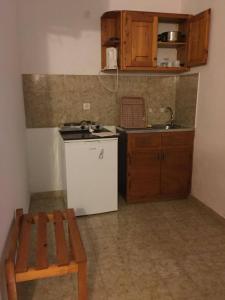 A kitchen or kitchenette at Avgoustina Venus Studios