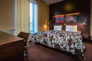Ένα ή περισσότερα κρεβάτια σε δωμάτιο στο Hotel Villa Bianca