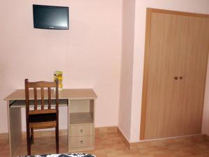 TV a/nebo společenská místnost v ubytování Hostal Abastos