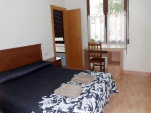 Postel nebo postele na pokoji v ubytování Hostal Abastos