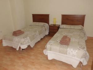 Postel nebo postele na pokoji v ubytování Hostal Abastos