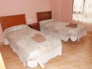 Postel nebo postele na pokoji v ubytování Hostal Abastos