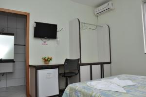TV a/nebo společenská místnost v ubytování Hotel Lisbor
