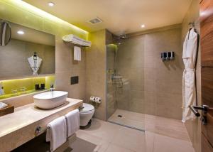 a bathroom with a shower, toilet and sink at Occidental Punta Cana - All Inclusive Resort - Barcelo Hotel Group "Newly Renovated" in Punta Cana