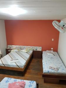 Cama ou camas em um quarto em Hotel Cabo Finisterra