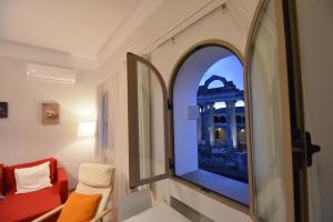 Posezení v ubytování Apartamentos Templo Diana -Vistas Históricas-