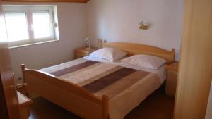 Posteľ alebo postele v izbe v ubytovaní Apartments Dorkin