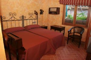A bed or beds in a room at Casa Rural Capricho del Valle