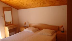 Posteľ alebo postele v izbe v ubytovaní Apartments Dorkin