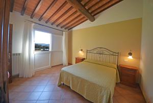 Postel nebo postele na pokoji v ubytování Agriturismo L'Imposto