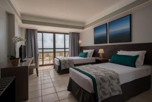 Cama ou camas em um quarto em Wish Natal